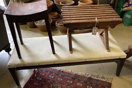 An early 19th century provincial mahogany stool, a fender stool and one other